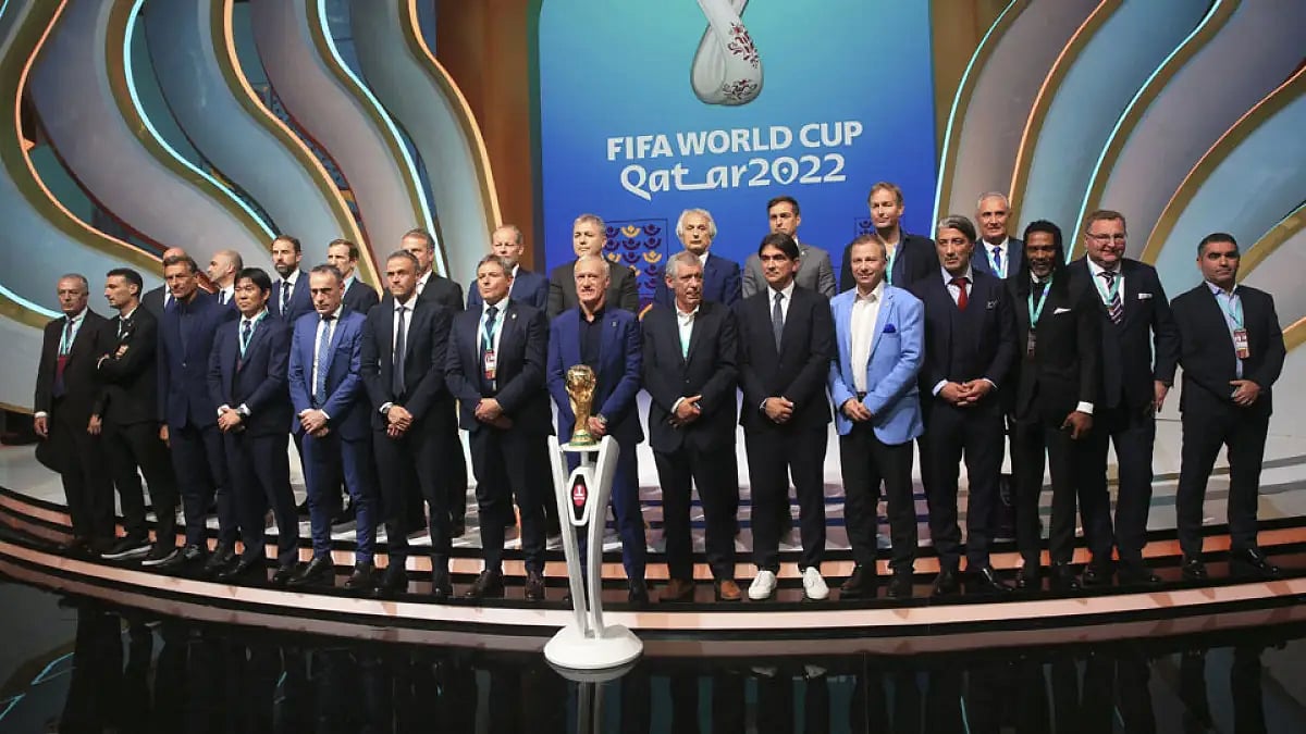 Coaches pose for a group photo following the FIFA World Cup 2022 draw at Doha, Qatar, April 1.