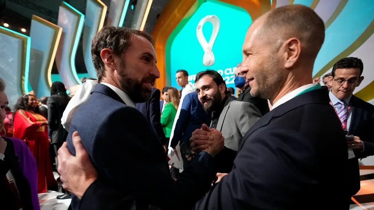 England coach Gareth Southgate (L) talks to USA's Gregg Berhalter at 2022 FIFA World Cup draw.