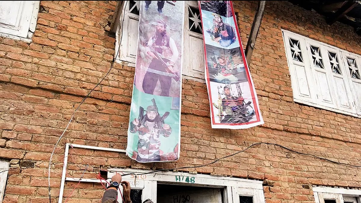 Posters of militants at a building - null