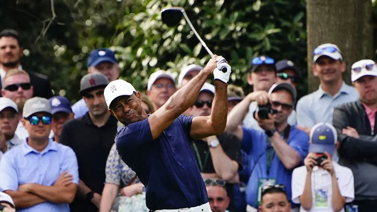 Tiger Woods tees off on the seventh hole during a practice round for the Masters golf tournament.