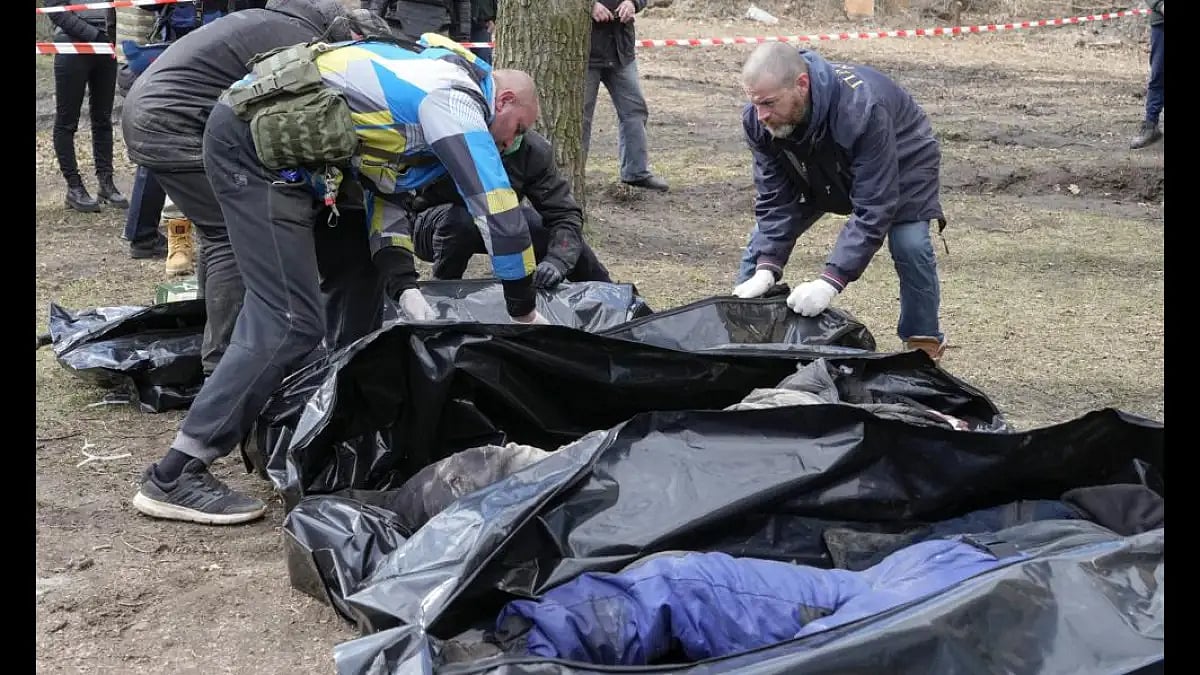 Volunteers collect bodies of murdered civilians, in Bucha, close to Kyiv, Ukraine