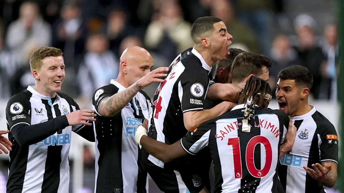 Newcastle players celebrate Chris Wood's goal against Wolves during their EPL match.