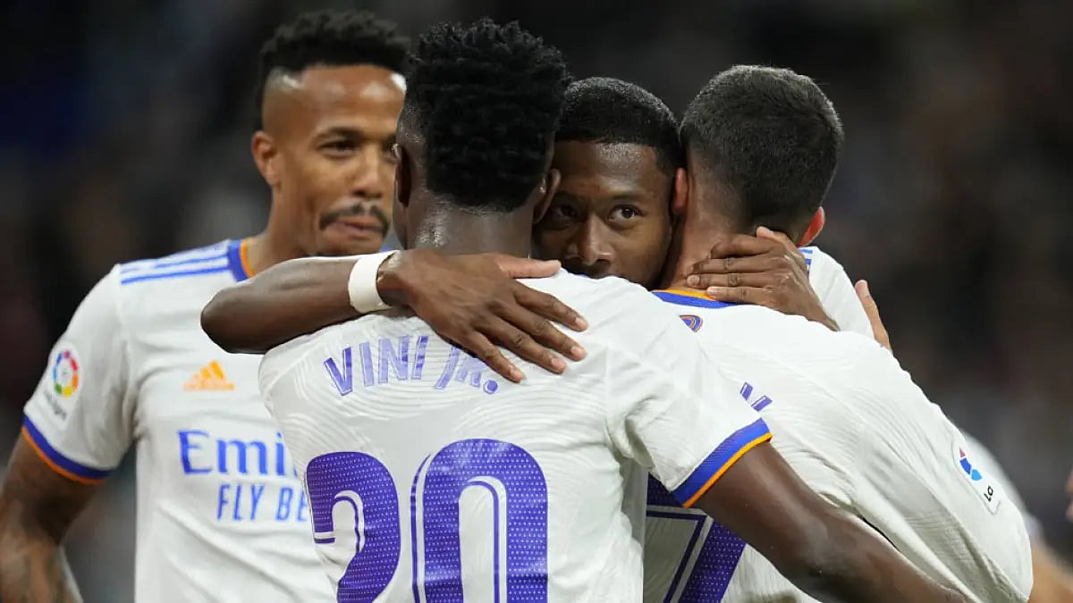 Real Madrid players celebrate a goal against Getafe during their La Liga match.
