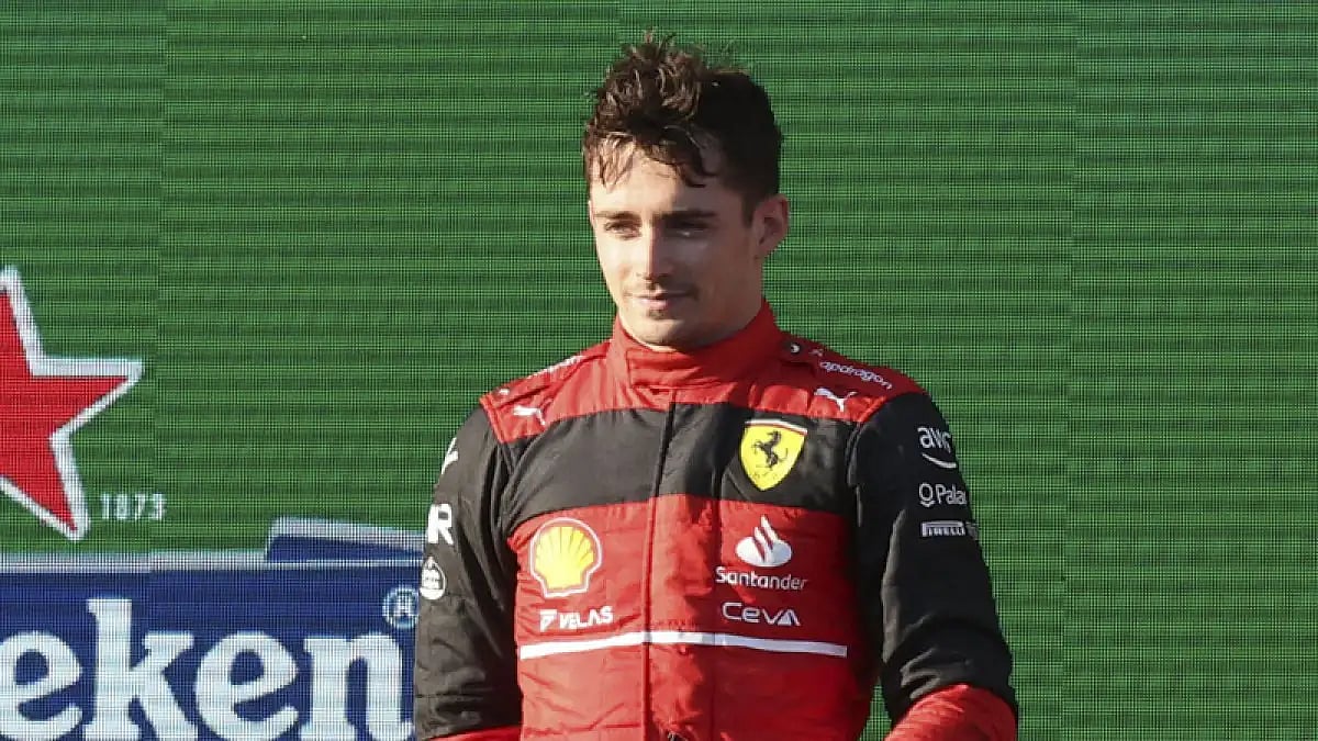 Ferrari driver Charles Leclerc stands on the podium after winning the Australian Grand Prix in Melbourne.