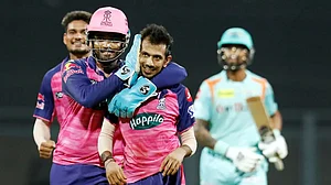 Yuzvendra Chahal is congratulated by captain Sanju Samson after taking a LSG wicket in IPL 2022.