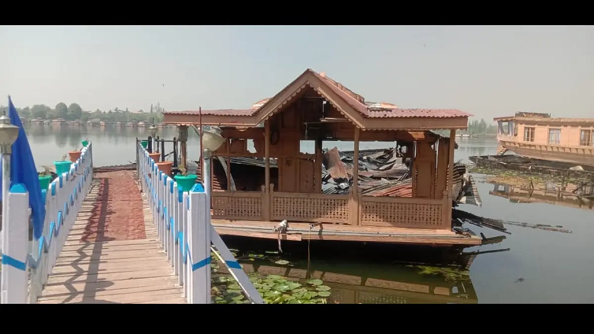 Wreakage of burnt houseboat in Srinagar's Nigeen lake.