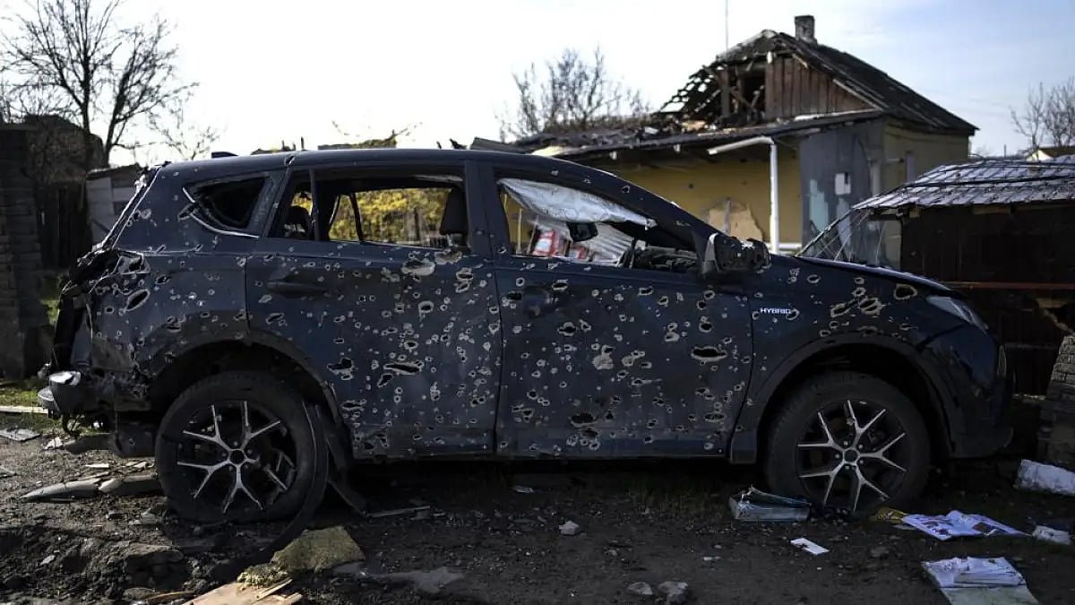 A car riddled with bullet holes due to the war with Russia is seen in Bucha, in the outskirts of Kyi