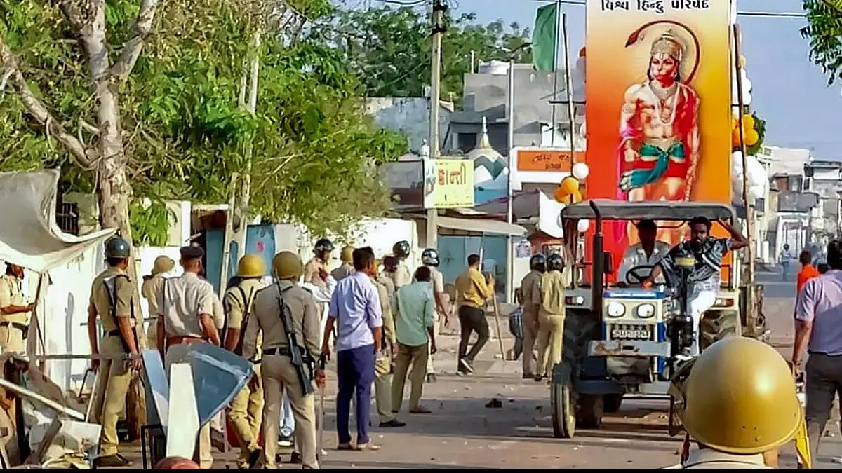 Police control the situation after a communal clash during the Ram Navami procession in Himmatnagar