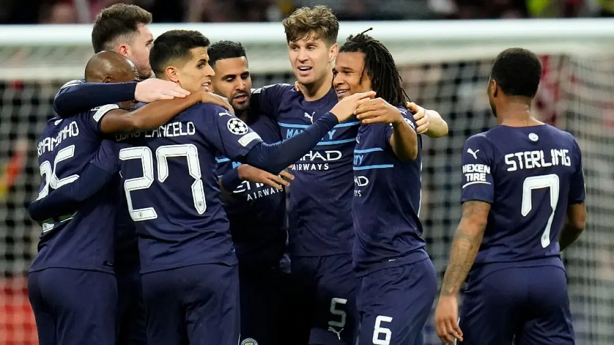 Manchester City players celebrate after beating Atletico Madrid in UEFA Champions League quarters.
