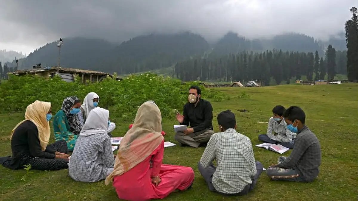 Students attend open-air school in Kashmir.