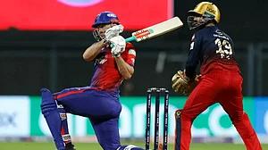 Delhi Capitals' Mitchell Marsh tries to play a shot vs Royal Challengers Bangalore in IPL 2022.