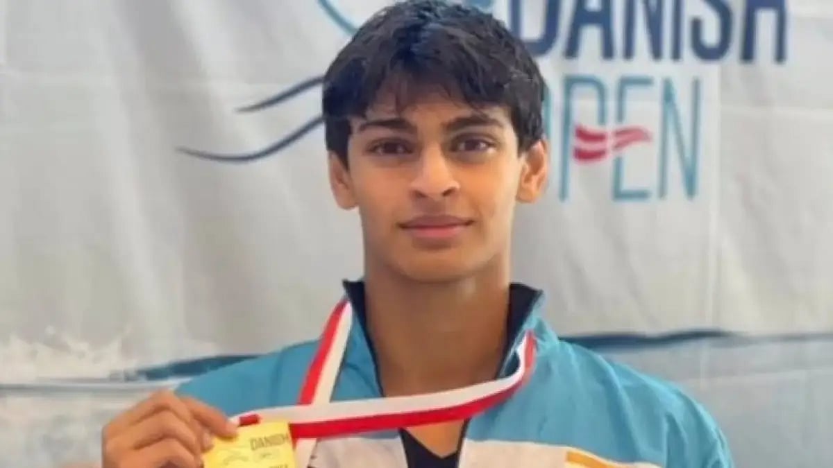 Veedant Madhavan poses with his gold medal at Danish Open 2022 swimming competition.  