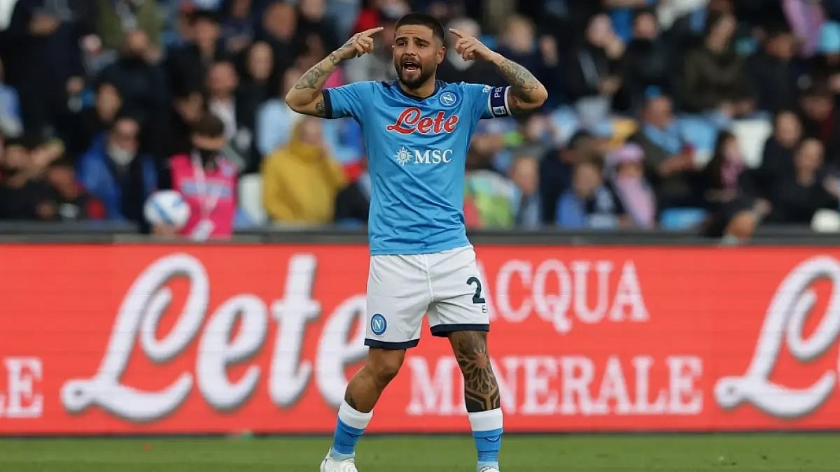 Napoli's Lorenzo Insigne celebrates after scoring against Roma in a Serie A 2021-22 match.