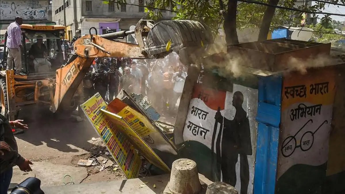 Bulldozer razing a structure in Jahangirpuri 