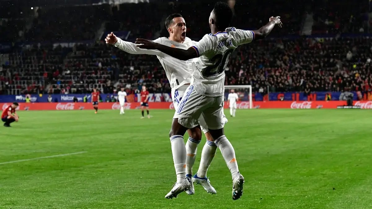 Real Madrid's Lucas Vazquez (L) celebrates with Vinicius Junior after scoring vs Osasuna in La Liga.