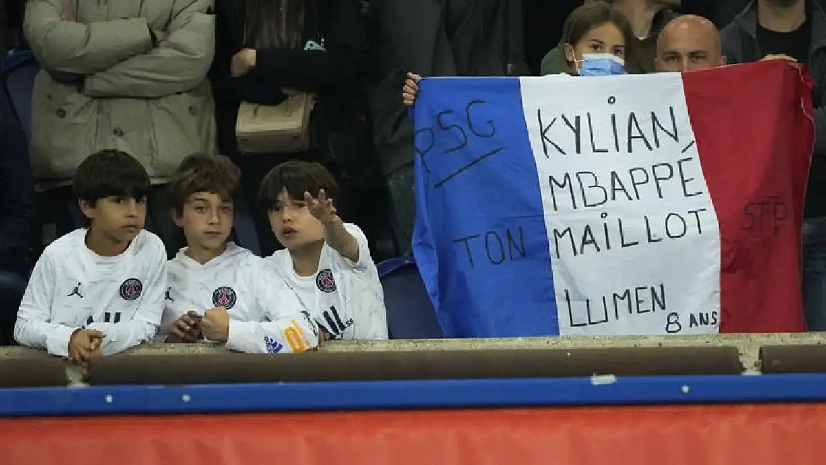 PSG's fans support their team during their French League One soccer match against Lens on Saturday.