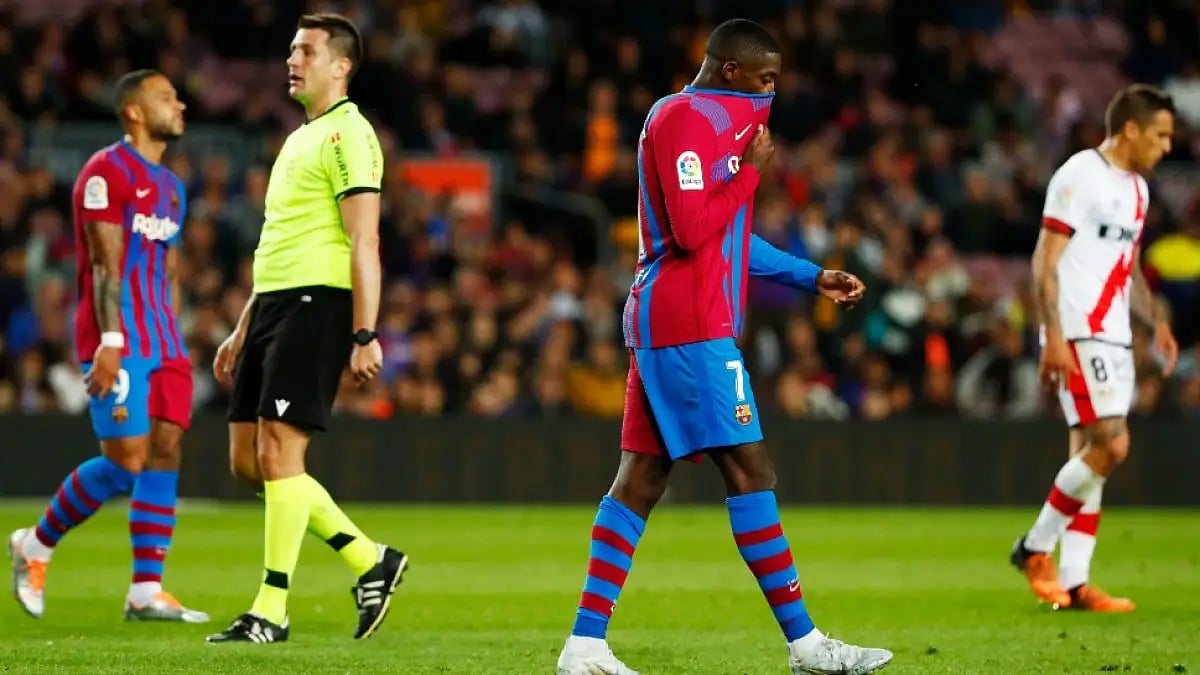 Barcelona's Ousmane Dembele (C) reacts after losing against Rayo Vallecano in La Liga.