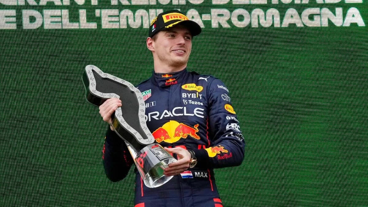 Max Verstappen smiles on the podium after winning the Emilia Romagna Formula One Grand Prix.