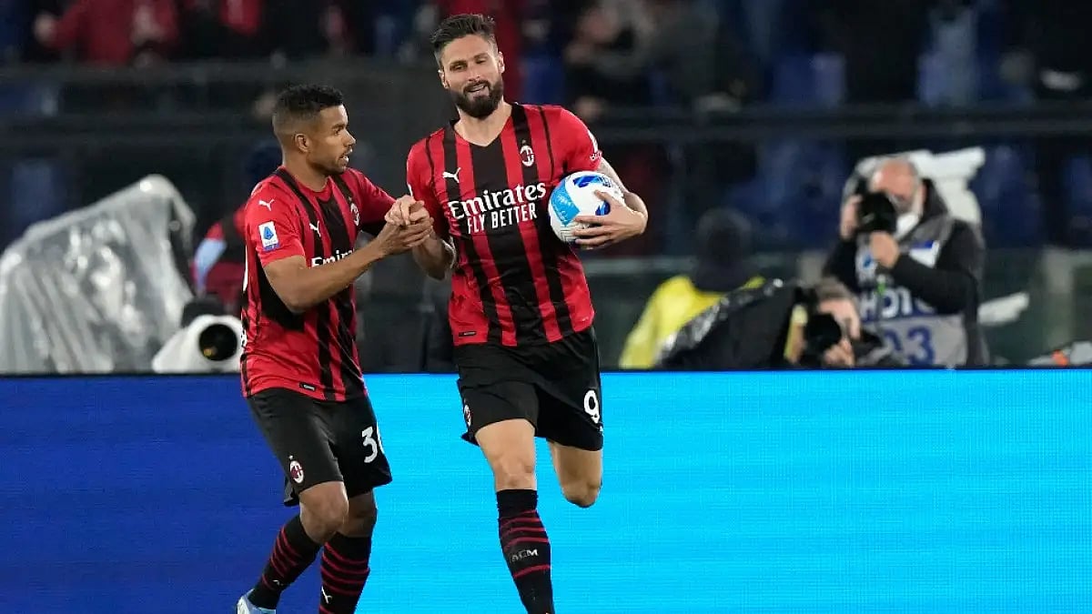 AC Milan's Olivier Giroud celebrates after scoring against Lazio in a Serie A 2021-22 tie.