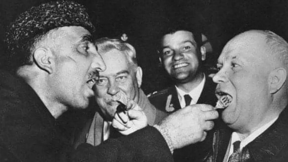 Bakshi Ghulam Mohammad and Khrushchev feeding each other 'Ghustaba'