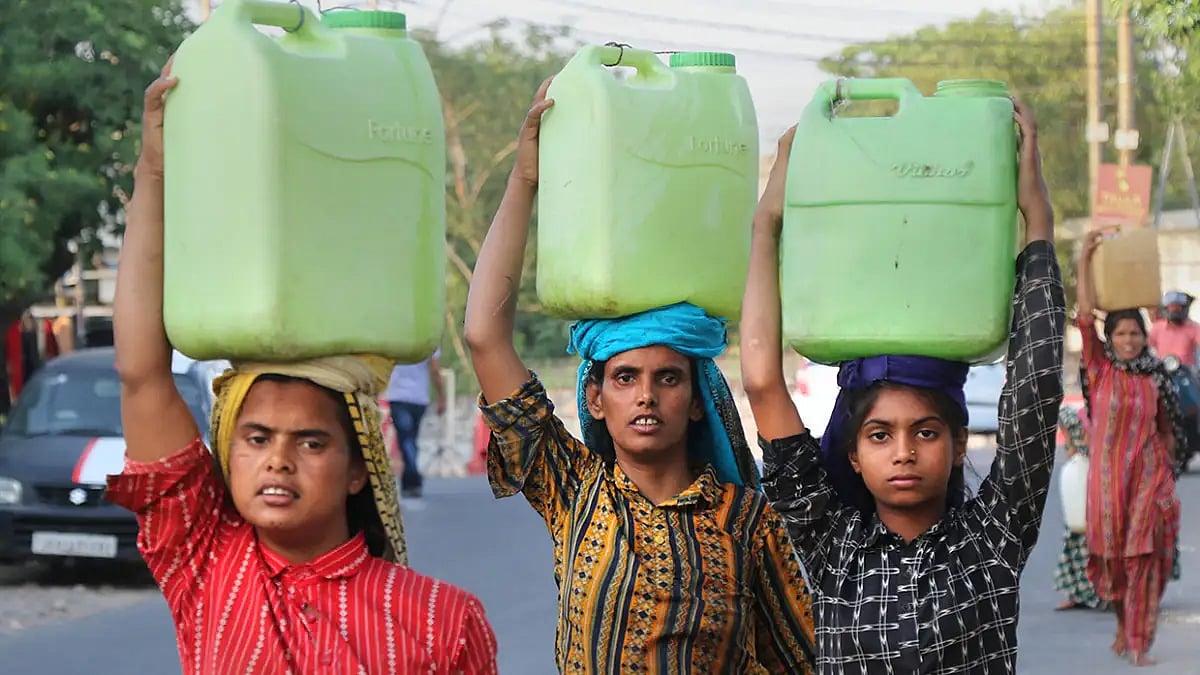 Women carry drinking water 