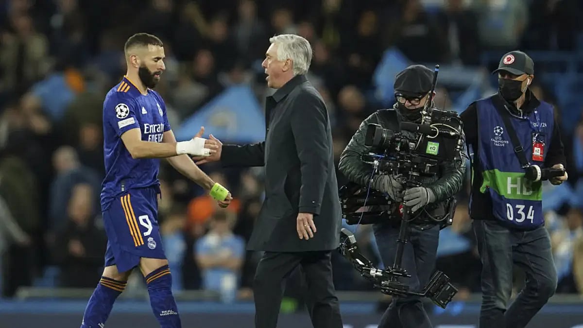 Real Madrid's head coach Carlo Ancelotti greets Karim Benzema, left, at the end of their Champions League semi-final, first leg match against Manchester City.