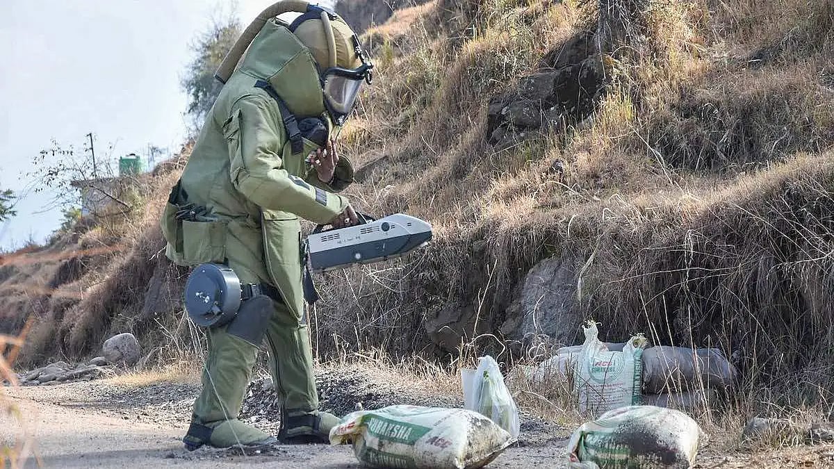Bomb Disposal Squad member disposing off Improvised Explosive Device (IED)