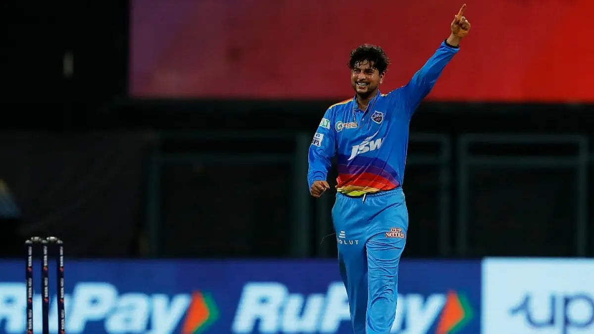 Kuldeep Yadav celebrates after taking one of his four wickets against KKR in an IPL 2022 tie.