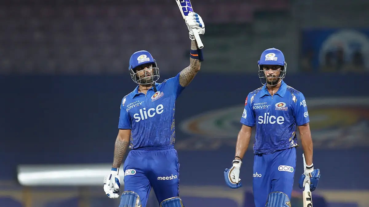 Suryakumar Yadav raises his bat after his fifty against Rajasthan Royals in an IPL 2022 game.