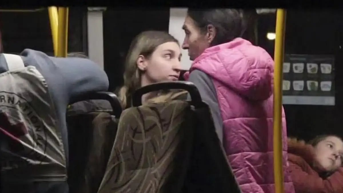 Civil evacuees sit in a bus after leaving Mariupol Steel Plant in Ukraine