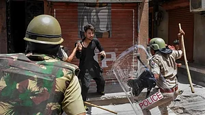 Police charging an alleged miscreant at Jalori Gate in Jodhpur, Rajasthan, on Tuesday