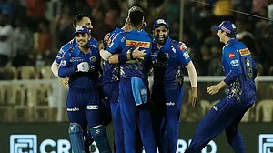 Mumbai Indians players celebrate their win over Gujarat Titans in IPL 2022. Get GT vs MI highlights.
