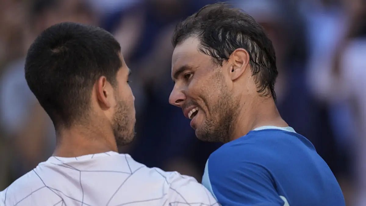 Rafael Nadal, right, congratulates Carlos Alcaraz after their match at Madrid Open, May 6, 2022.