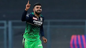 Wanindu Hasaranga celebrates one of his five wickets against Sunrisers Hyderabad in IPL 2022.