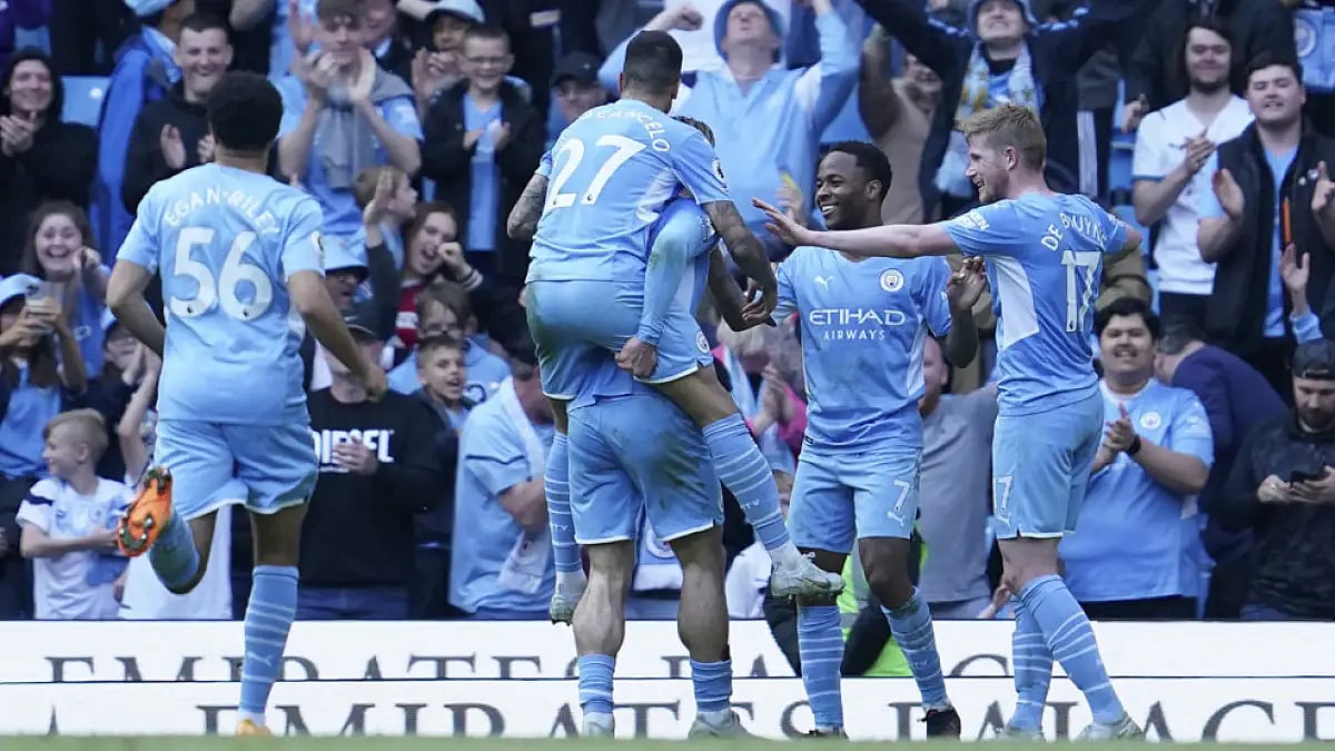 Manchester City players celebrate a goal against Newcastle on May 8, 2022.