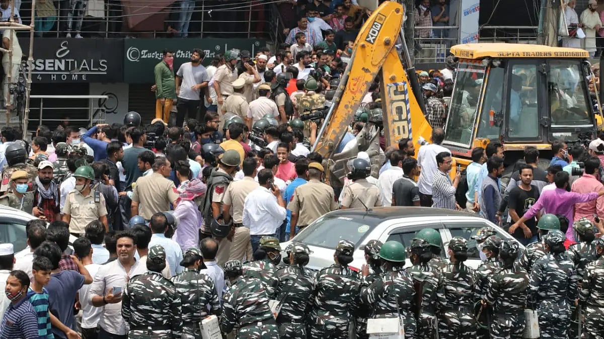 A bulldozer in the main market of Shaheen Bagh.