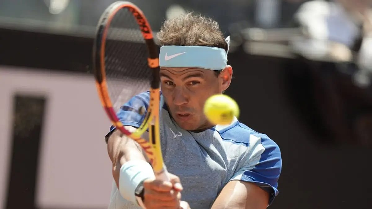 Rafael Nadal returns the ball to John Isner during their match at Italian Open 2022 on Wednesday.