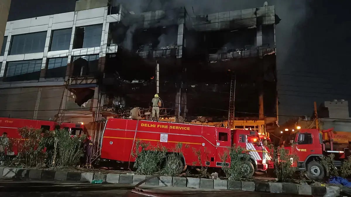 Delhi Fire Services personnel at the site of fire in Mundka, Delhi