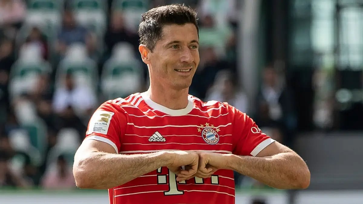 Bayern Munich's Robert Lewandowski celebrates after scoring against Wolfsburg in Bundesliga 2021-22.