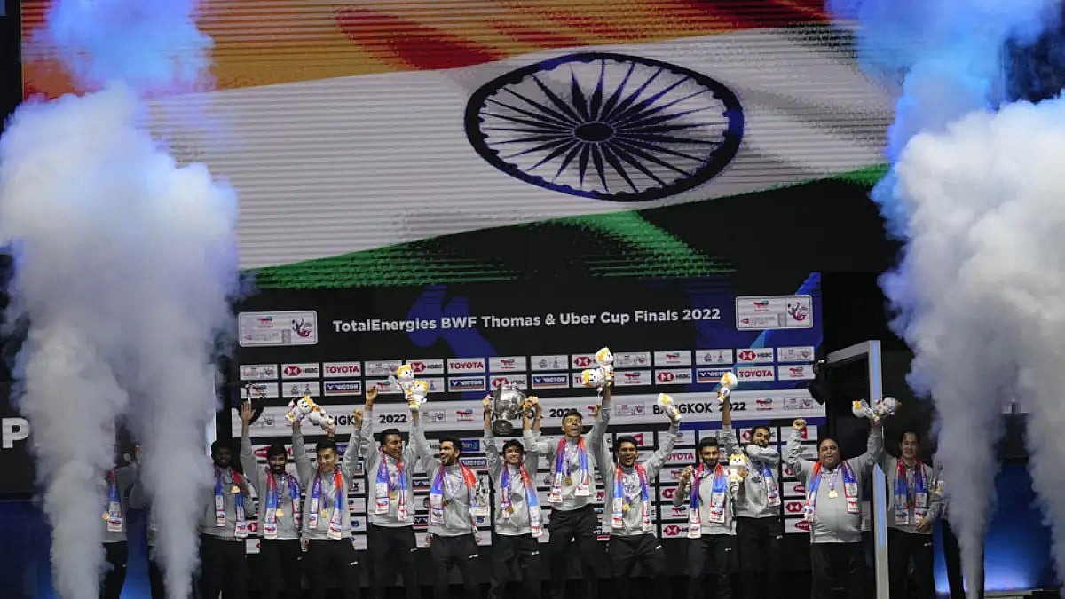 India's team members hold the trophy after winning Thomas Cup title in Bangkok, Thailand, May 15, 2022.