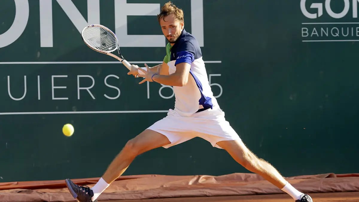 Daniil Medvedev of Russia returns a ball to Richard Gasquet of France during their Geneva Open match, May 17, 2022.