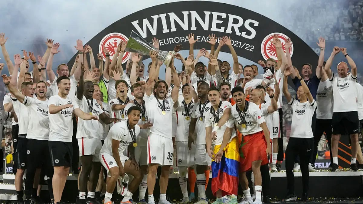 Eintracht Frankfurt players celebrate with the trophy after winning the Europa League final against Rangers FC in Seville, Spain, May 18, 2022.