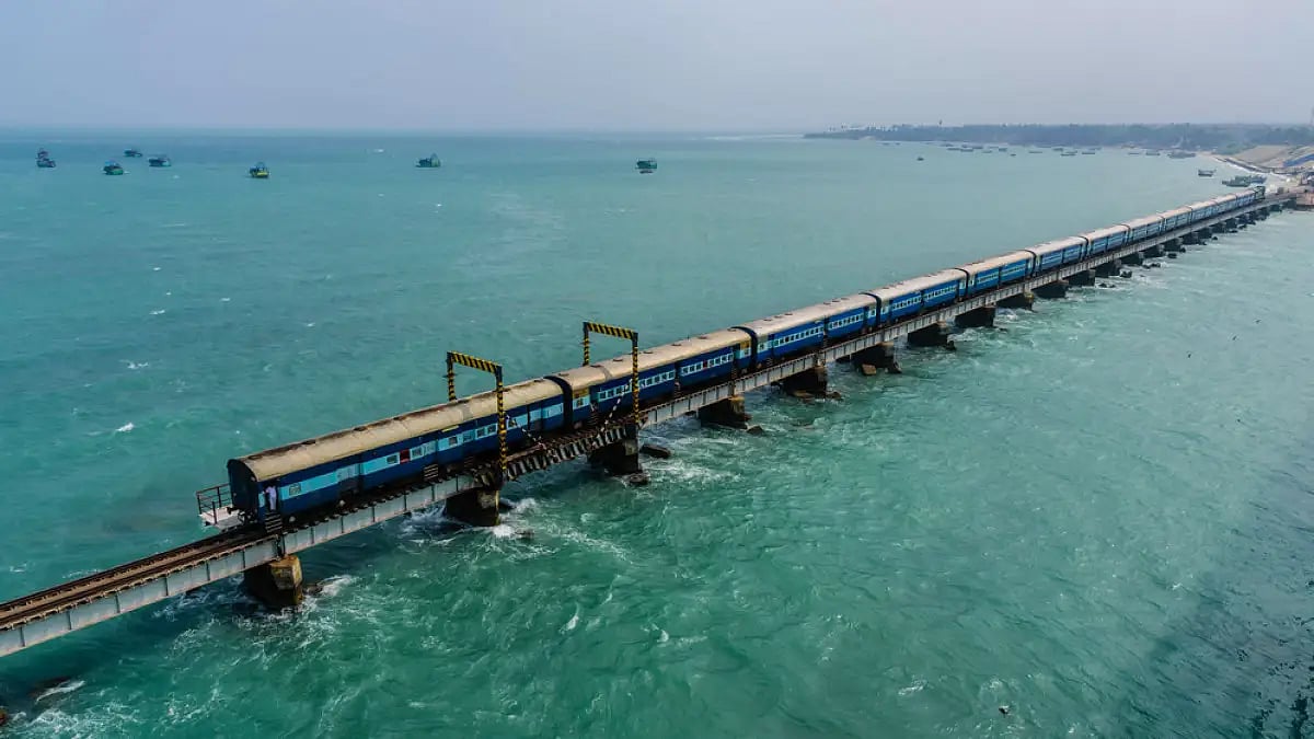 A train moves along Pamban Bridge which connects the town of Rameswaram on Pamban Island to mainland