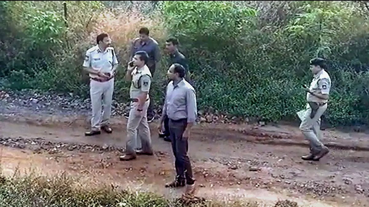 Police officials at the site of the encounter of four accused in Telangana veterinarian's rape-murde