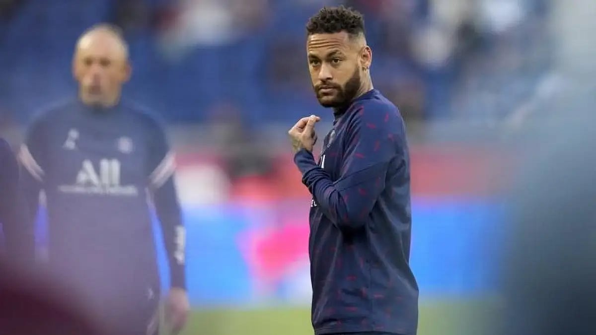 Neymar warms up prior to the start of the French League One soccer match between PSG and Troyes on M
