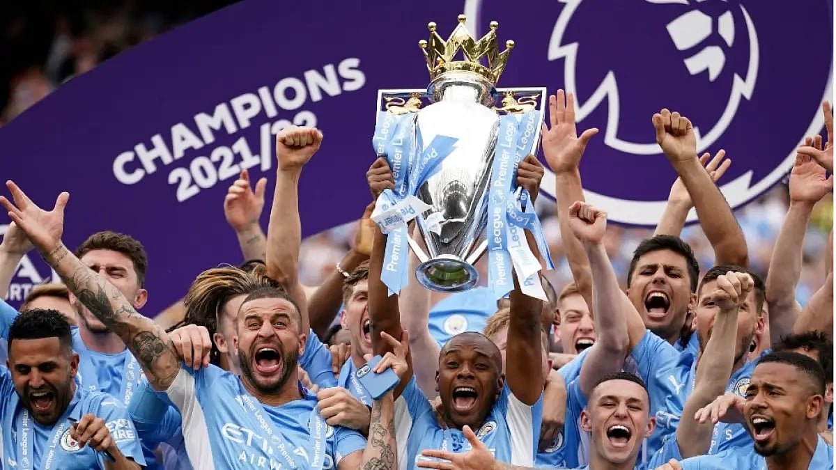 Manchester City players lift English Premier League 2021-22 title.