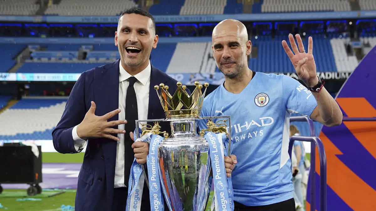 Manchester City manager Pep Guardiola with chairman Khaldoon Al Mubarak after winning English Premier League 2022.