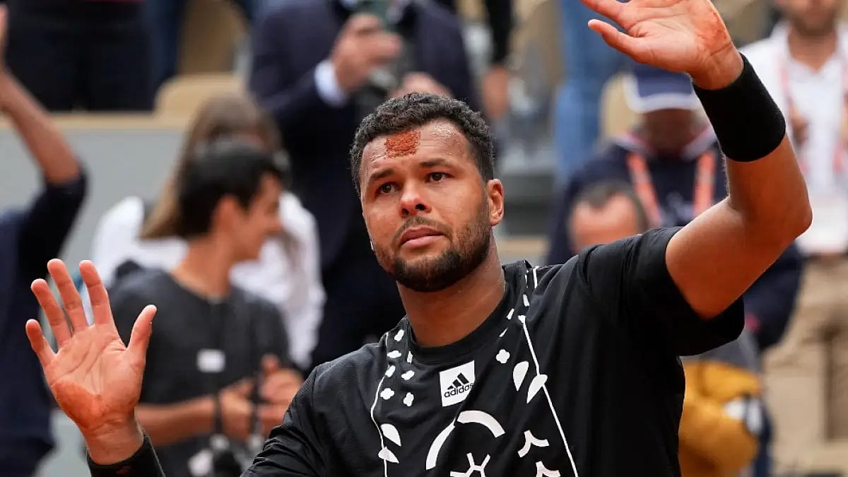 Jo-Wilfried Tsonga gestures toward the crowds after playing his final game at French Open 2022.