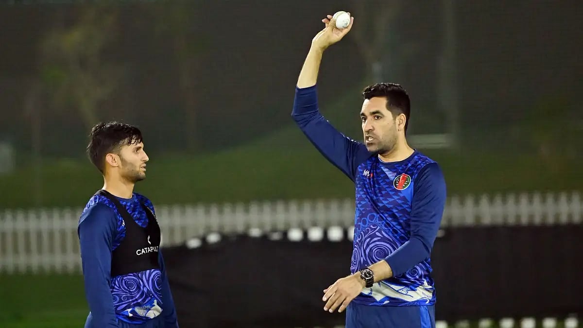 Umar Gul (R) discusses a point during Afghanistan's training session.  