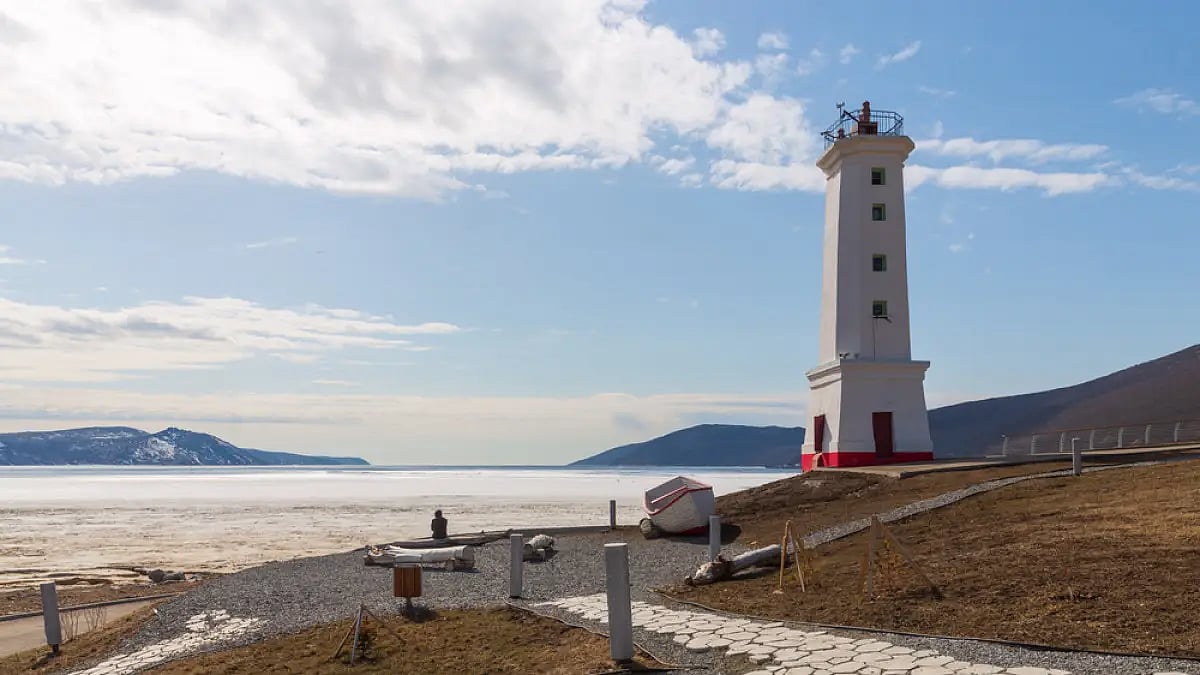 The Park Lighthouse looks out over the ice-covered Nagaev Bay on the Sea of Okhotsk in Magadan, Russ